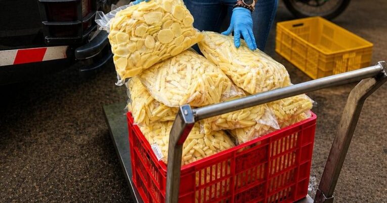 Vacuum-packed fresh-cut potatoes in a delivery crate